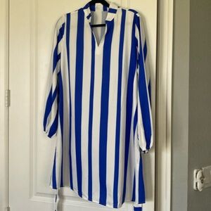 Women blue and white stripes, long sleeves . Collar with v front.